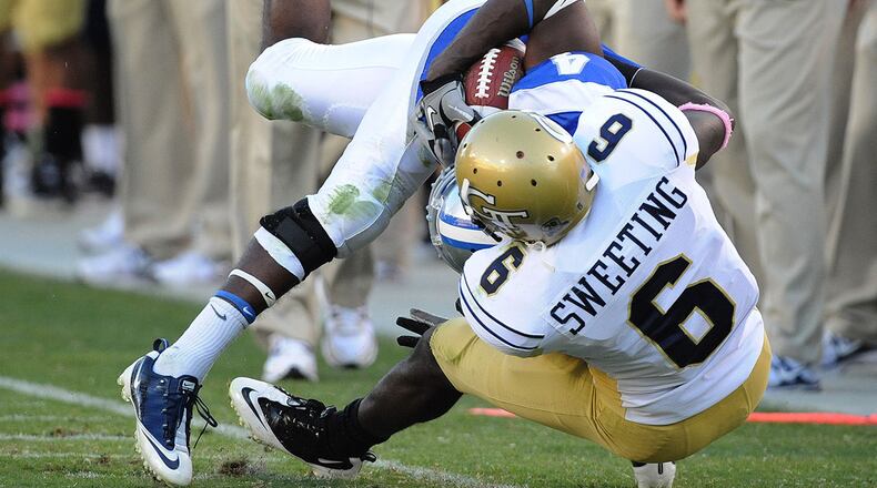 10101- Atlanta - Georgia Tech's Rod Sweeting (6) tackles Middle Tennessee State's Malcolm Beyah (4) at Bobby Dodd Stadium on Saturday, Oct 16, 2010. Tech won 42-14. Johnny Crawford jcrawford@ajc.com Cornerback Rod Sweeting was an undrafted free agent out of Tech, he was signed by the New Orleans Saints. (Johnny Crawford / AJC File)