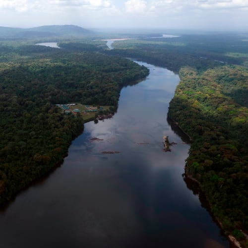 FILE - The Essequibo River flows through Kurupukari crossing in Guyana, Nov. 19, 2023. (AP Photo/Juan Pablo Arraez, File)