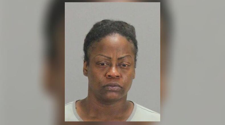 Tameka Scrivens, 42, was arrested on multiple charges, including murder, in connection with her husband's stabbing death, Clayton County police said.