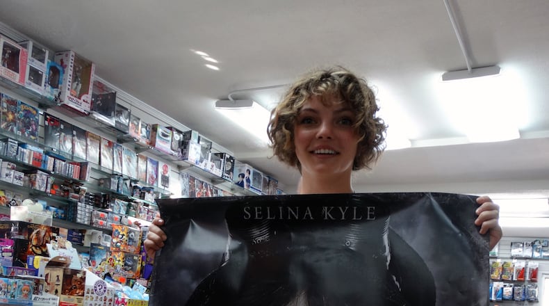 Camren Bicondova shows off a big poster of herself in "Gotham" at Oxford Comics & Books on Piedmont Ave. in Buckhead Sept. 3, 2014. CREDIT: Rodney Ho/rho@ajc.com