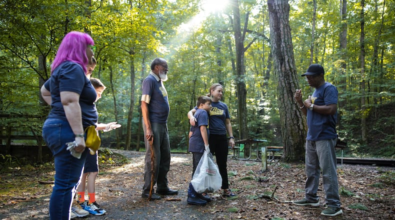 Hannah Palmer, center, led a group of neighbors on a cleanup of Utoy Creek as part of Atlanta Creek League, which invites residents to join their local creek “team” and compete for points by completing activities. Rodney Cofield Jr./Courtesy of Atlanta Creek League