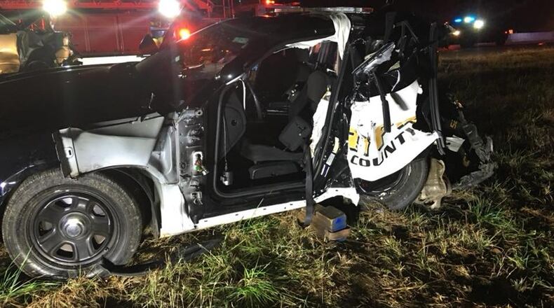 A Forsyth County Sheriff's Office deputy was injured when a vehicle driven by a suspected DUI driver crashed into his parked patrol car on Ga. 400.