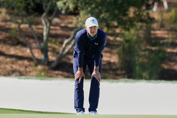 Jordan Spieth lines up a shot on the 15th green during the first round of The Players Championship golf tournament Thursday, March 13, 2025, in Ponte Vedra Beach, Fla. (AP Photo/Chris O'Meara)