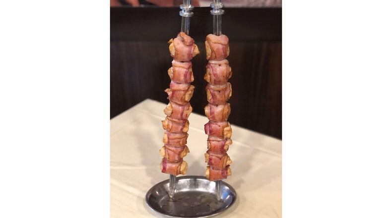 Frango -- bacon-wrapped chicken -- from the menu of Passador Brazilian Steakhouse. / Courtesy of Passador Brazilian Steakhouse