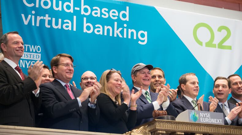 Q2 Holdings Chairman Hank Seale, center wearing baseball cap, joins with members of the Q2 Holdings team as they rang the opening bell at the New York Stock Exchange on Thursday, the first day of trading for Q2 Holdings stock. 
Credit: Ben Hider/NYSE Euronext