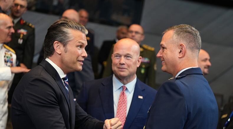 United States Defense Secretary Pete Hegseth, left, speaks with NATO's Supreme Allied Commander Europe General Alexus Grynkewich, right, during a meeting of the North Atlantic Council in defense ministers format at NATO headquarters in Brussels, Thursday, June 18, 2026. (AP Photo/Virginia Mayo)