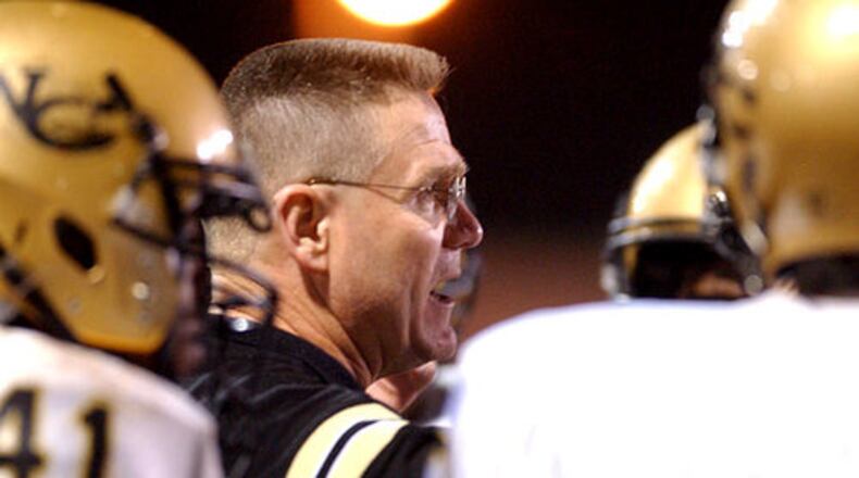 Current Appling County coach Rick Tomberlin (center, with former team Washington Co., in 2004) has been a head coach at nine schools in Georgia.