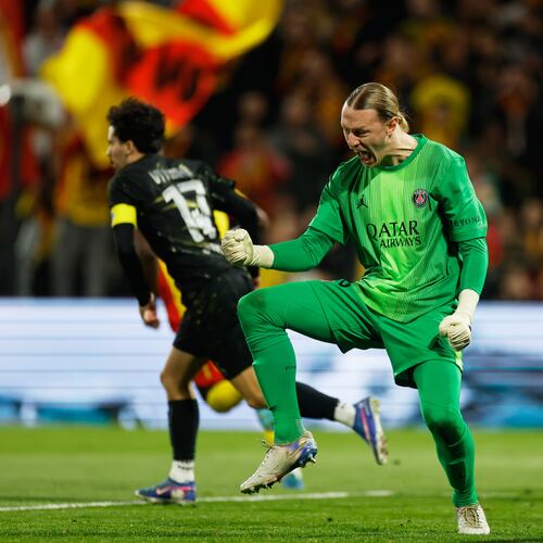 PSG's goalkeeper Matvey Safonov reacts after making a save during the French League One soccer match between Lens and Paris Saint Germain, in Lens, northern France, Wednesday, May 13, 2026. (AP Photo/Jean-Francois Badias)