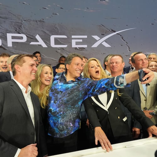 Gwynne Shotwell, President and COO of SpaceX, right, poses with colleagues during a bell ringing ceremony for the IPO of SpaceX at the Nasdaq MarketSite in New York, Friday, June 12, 2026, in New York. (AP Photo/Frank Franklin II)