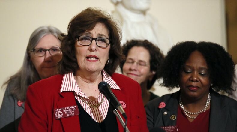 State Rep. Debbie Buckner, D-Junction City, leads off a press conference Tuesday about legislation that would remove Georgia’s tax on menstrual products. Bob Andres / bandres@ajc.com