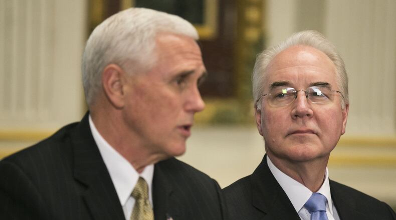 Tom Price, right, the health and human services secretary listens as Vice President Mike Pence speaks during a meeting with conservative groups regarding the pending American Health Care Act, at the Eisenhower Executive Office building in Washington, March 10, 2017. (Al Drago/The New York Times)
