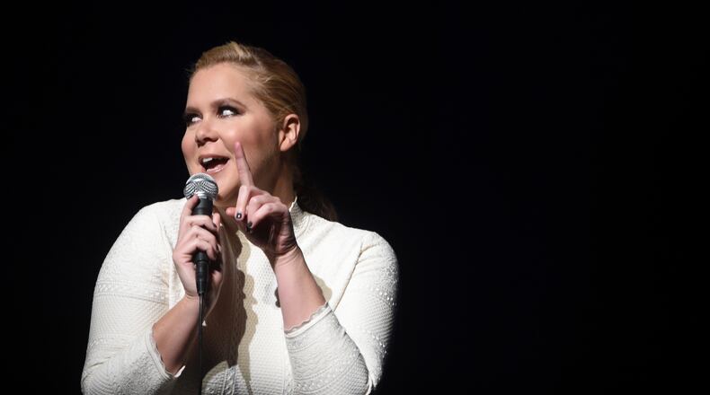 NEW YORK, NY - NOVEMBER 16: Actress Amy Schumer performs onstage as Baby Buggy celebrates 15 years with "An Evening with Jerry Seinfeld and Amy Schumer" presented by Bank of America - Inside at Beacon Theatre on November 16, 2015 in New York City. (Photo by Jamie McCarthy/Getty Images for Baby Buggy)