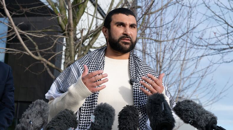 British political commentator Sami Hamdi speaks to the media in London, Thursday, Nov. 13, 2025, on his return to the U.K. after he was arrested by Immigration and Customs Enforcement on Oct. 26 while on a speaking tour in the U.S.. (AP Photo/Thomas Krych)
