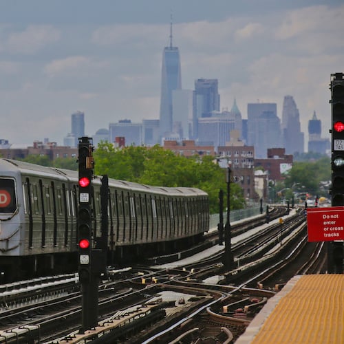 FILE - A subway approaches an above ground station in the Brooklyn borough of New York with the New York City skyline in the background, June 21, 2017. (AP Photo/Bebeto Matthews, File)