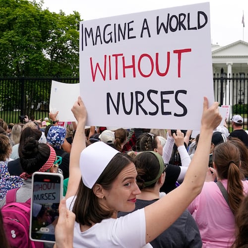 FILE - People protest outside the White House in Washington, May 12, 2022. (AP Photo/Susan Walsh)