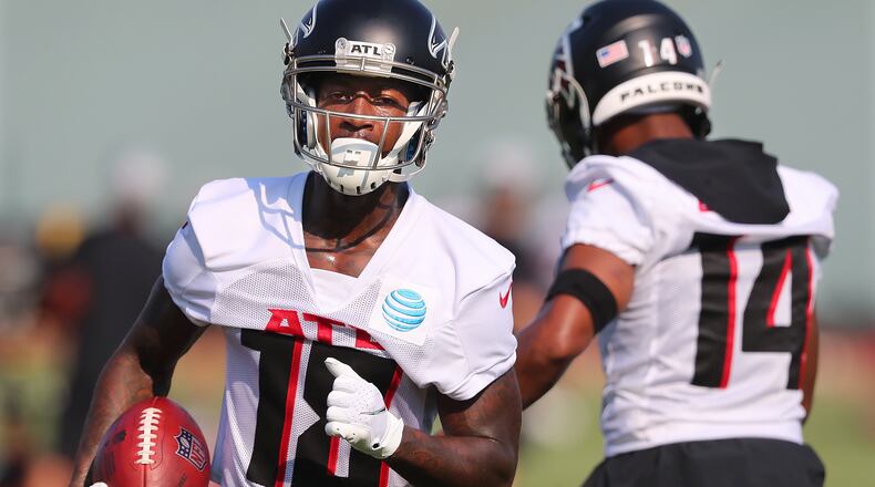 Falcons' top wide receiver Calvin Ridley catches a pass on the first day of practice during training camp Thursday, July 29, 2021, at the team's training facility in Flowery Branch. (Curtis Compton / Curtis.Compton@ajc.com)