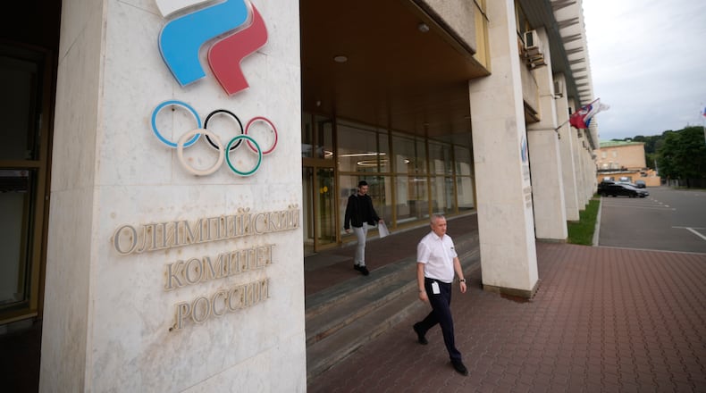 A man walks from the Russian National Olympic Committee building in Moscow, on Tuesday, July 7, 2026. (AP Photo/Pavel Bednyakov)