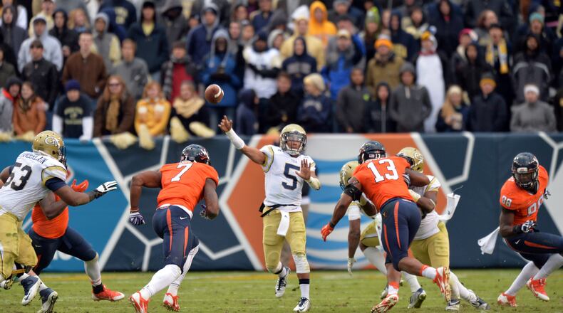 Georgia Tech Yellow Jackets quarterback Justin Thomas (5) gets off a pass against the Virginia Cavaliers in the second half at Bobby Dodd Stadium on Saturday, November 1, 2014. Georgia Tech Yellow Jackets won 35-10 over the Virginia Cavaliers. HYOSUB SHIN / HSHIN@AJC.COM