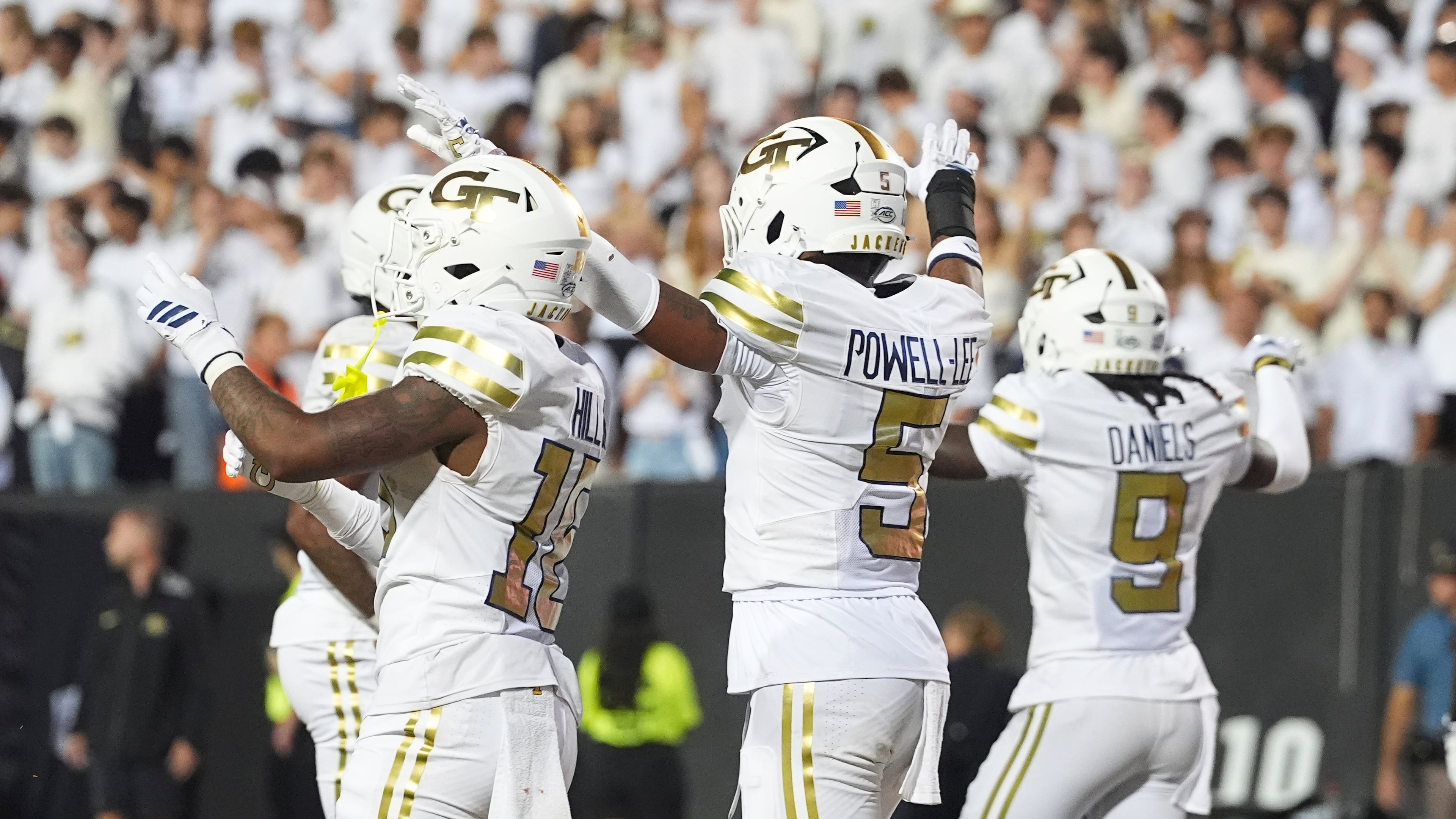 From left, Georgia Tech's Tah'j Butler (partially obscured), Kelvin Hill, Clayton Powell-Lee and Omar Daniels (right) celebrate after opening the season with a win over Colorado on Friday, Aug. 29, 2025, in Boulder, Colo. (David Zalubowski/AP)