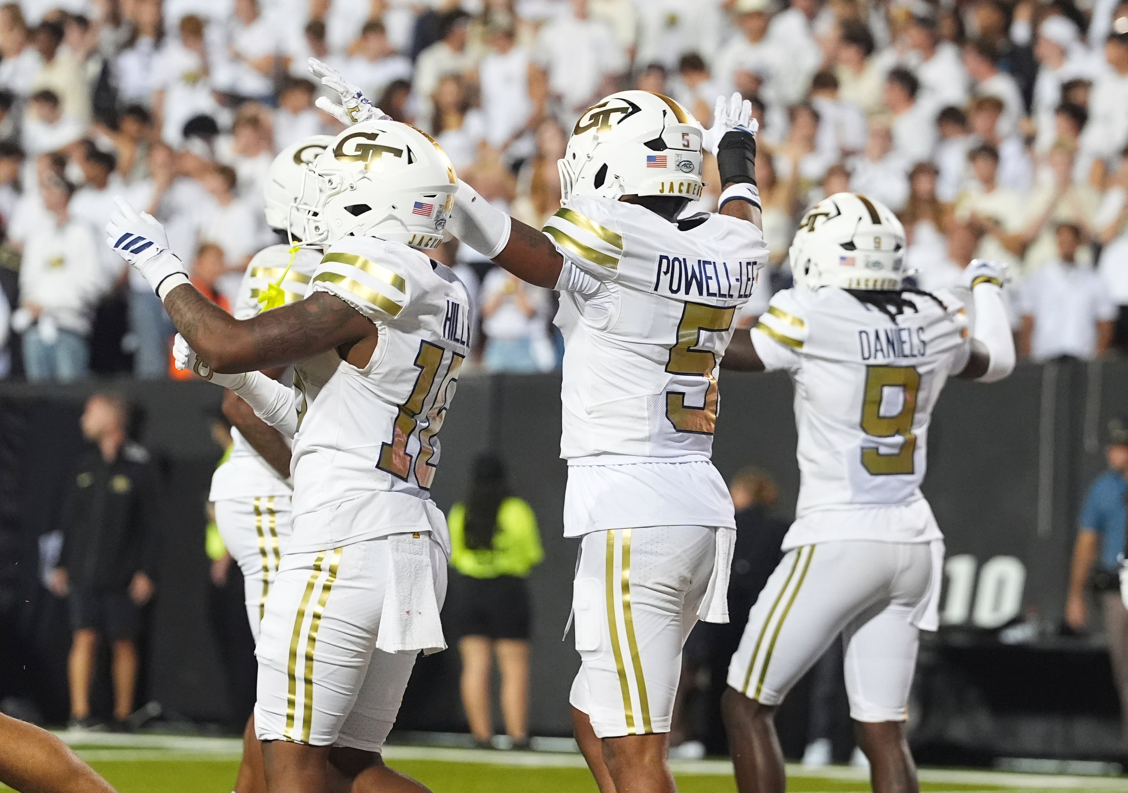 From left, Georgia Tech linebacker Tah'j Butler and defensive backs Clayton Powell-Lee and Omar Daniels react after defeating Colorado in an NCAA college football game Friday, Aug. 29, 2025, in Boulder, Colo. (AP Photo/David Zalubowski)