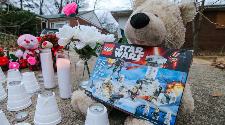 A memorial was placed on Jasper Street in Atlanta near where a boy was killed and a girl was injured in a pit bull attack on their way to school. The mother of the boy, Logan Braatz, filed suit against LifeLine Animal Project, Fulton County’s animal control provider. AJC FILE PHOTO