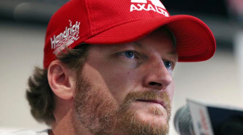 FILe - In this Aug. 5, 2016, file photo, Dale Earnhardt Jr. listens to a question about his concussion while addressing the media at Watkins Glen International racetrack in Watkins Glen, N.Y. Earnhardt will miss the rest of the NASCAR season as he continues to recover from a concussion. (AP Photo/Mel Evans, File)