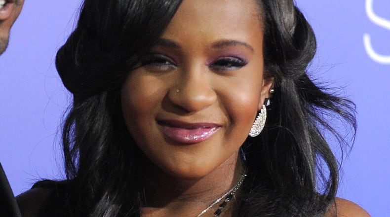 In this Aug. 16, 2012, file photo, Bobbi Kristina Brown attends the Los Angeles premiere of "Sparkle" at Grauman's Chinese Theatre in Los Angeles. The daughter of the late singer and entertainer Whitney Houston, who was in hospice care after months of receiving medical care, died on July 26, 2015.