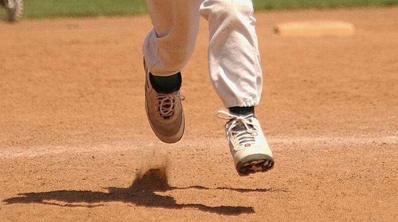 Stock photo of a young baseball player running the bases. (Photo credit: KeithJJ / Pixabay.com)