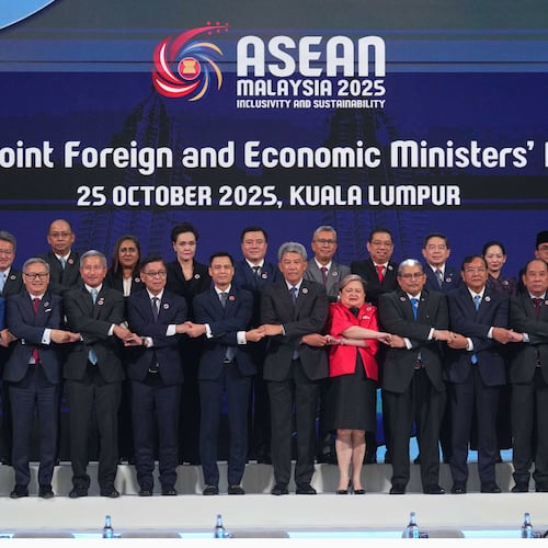 Foreign ministers and economic ministers of ASEAN member countries pose for a group photo during the ASEAN Joint Foreign and Economic Ministers' Meeting in Kuala Lumpur, Malaysia, on Saturday, Oct. 25, 2025. (AP Photo/Rafiq Maqbool)