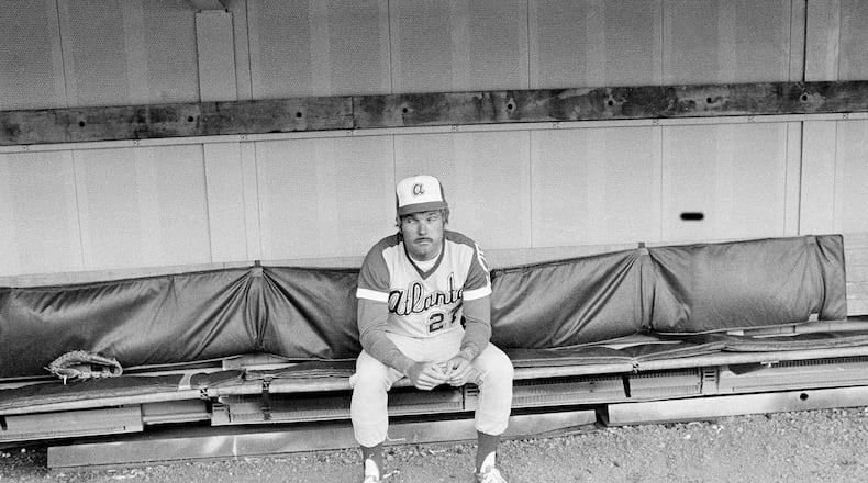 Braves acting manager Ted Turner sits alone in the dugout prior to a game against the Pirates on May 11, 1977, at Three Rivers Stadium in Pittsburgh.