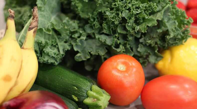 Groceries lay on a kitchen counter before being sorted for storage in the pantry and refrigerator Oct. 25, 2025, in Flagstaff, Ariz. (AP Photo/Cheyanne Mumphrey)