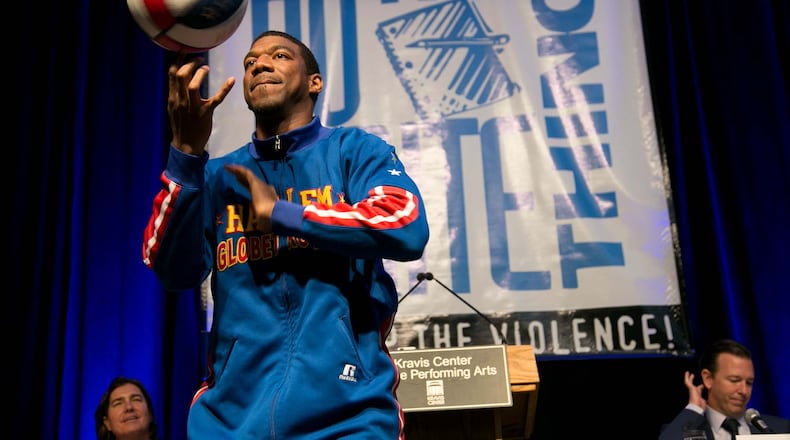 Harlem Globetrotters Anthony "Buckets" Blake performs at the Do the Write Thing Challenge luncheon at the Kravis Center in West Palm Beach, Florida on May 12, 2014. (Allen Eyestone / The Palm Beach Post)