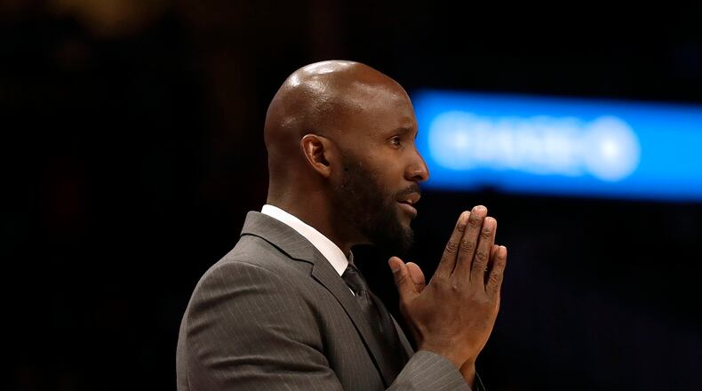 In this March 11, 2020, file photo, Hawks coach Lloyd Pierce looks on from the sideline during a game against the New York Knicks, in Atlanta.  (AP Photo/John Bazemore, File)