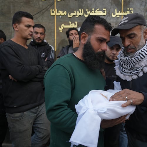 Palestinian Raed al-Khabba carries his 3-month-old daughter Mira al-Khabbaz, who was killed in an Israeli military strike, at Shifa Hospital in Gaza City, Wednesday, Feb. 4, 2026. (AP Photo/Jehad Alshrafi)