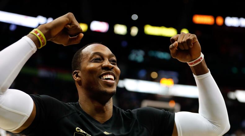 Atlanta Hawks center Dwight Howard (8) gestures to the crowd before an NBA basketball game against the Denver Nuggets, Wednesday, Feb. 8, 2017 in Atlanta. (AP Photo/John Bazemore)