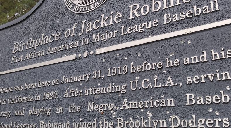 The historical marker recognizing the birthplace of African American baseball great Jackie Robinson was found riddled by gunfire the week of February 14, 2021 in Grady County, Ga. The defacement was one of at least two incidents in the past six months of vandalism to significant markers dedicated to the legacy of Black Georgians. Officials say the fact firearms were used is significant.