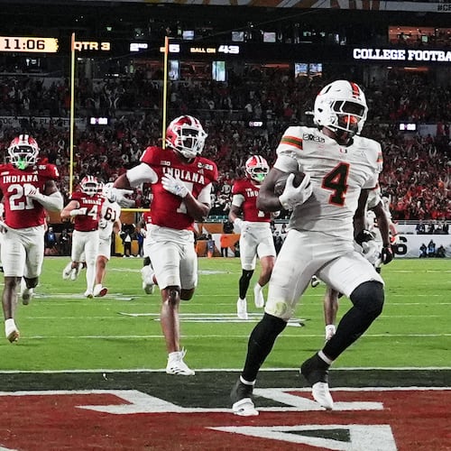 Miami running back Mark Fletcher Jr. scores against Indiana during the second half of the College Football Playoff national championship game, Monday, Jan. 19, 2026, in Miami Gardens, Fla. (AP Photo/Marta Lavandier)