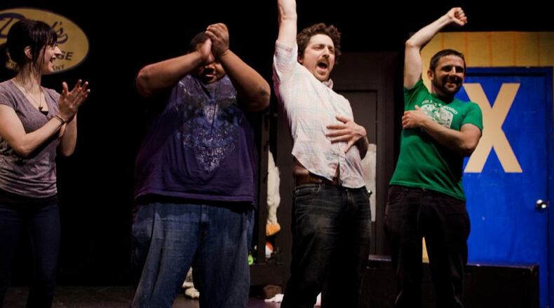 Kevin Gillese (second from right) will continue to perform with Dad's Garage and explore other artistic roles after transitioning out of the role of artistic director.