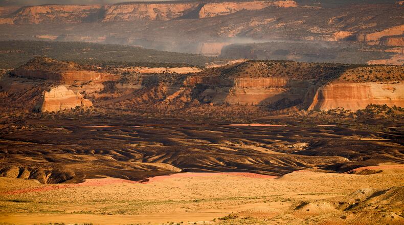 Smoke rises from the Snyder Fire burning near Thompson Springs, Utah, on Sunday, June 28, 2026. (AP Photo/Noah Berger)