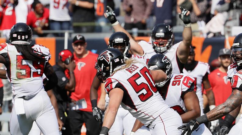 CHICAGO, IL - SEPTEMBER 10: Brooks Reed #50 of the Atlanta Falcons celebrates with teammates after sacking Mike Glennon #8 of the Chicago Bears on the next to last play during the season opening game at Soldier Field on September 10, 2017 in Chicago, Illinois. The Falcons defeated the Bears 23-17. (Photo by Jonathan Daniel/Getty Images)