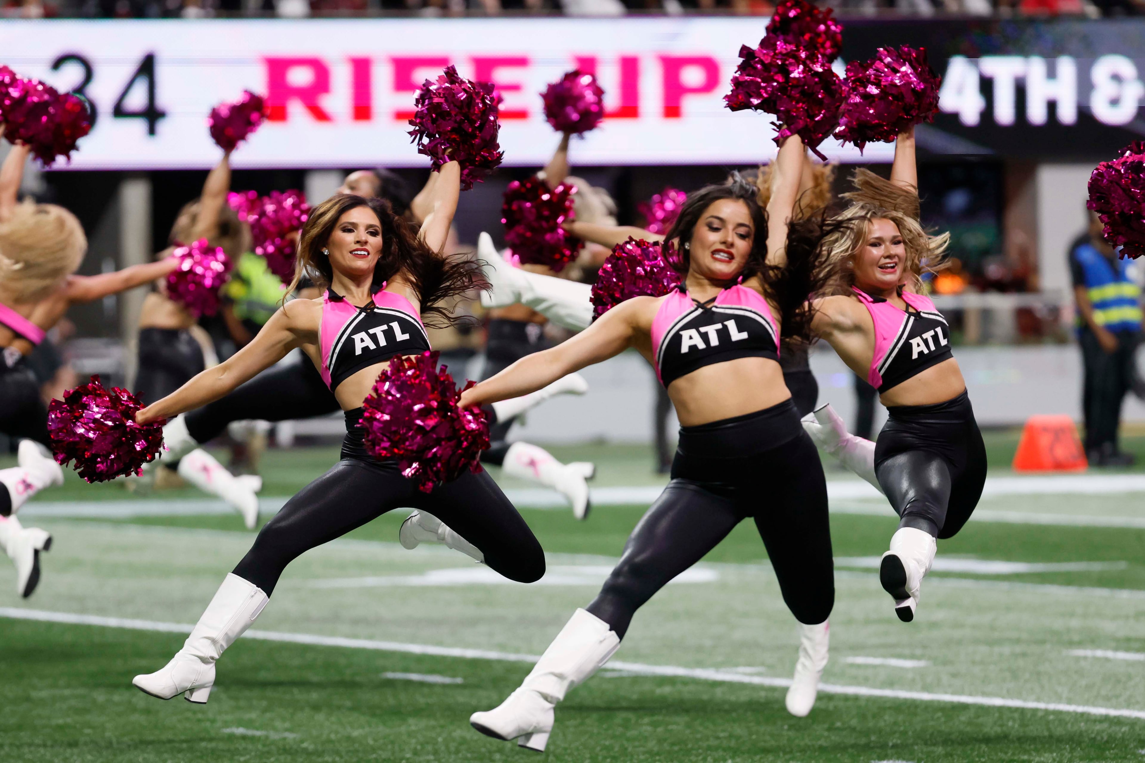 Atlanta Falcons cheerleaders perform during the second half of an NFL football game against the Washington Commanders at Mercedes-Benz Stadium in Atlanta on Sunday, September 28, 2025. (Miguel Martinez/AJC)