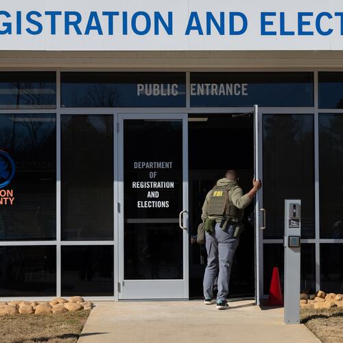 An FBI agent enters the Fulton County Election Hub and Operation Center in Union City on Wednesday, Jan. 28, 2026. (Arvin Temkar/AJC)