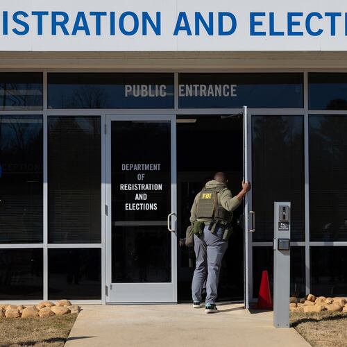 FBI agents enter the Fulton County Election Hub and Operation Center in Union City this past January. (Arvin Temkar/AJC)