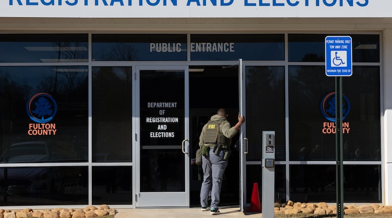 An FBI agent enters the Fulton County Election Hub and Operation Center in Union City on Wednesday, Jan. 28, 2026. (Arvin Temkar/AJC)