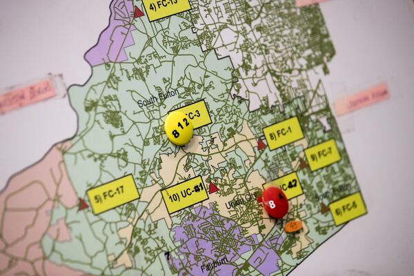 A map at the Fulton County Emergency Communications office in Atlanta shows the south Fulton area. The office handles 911 calls and dispatches ambulances for the cities of Fairburn, South Fulton, Union City, Chattahoochee Hills and Palmetto and for unincorporated Fulton County. (Alyssa Pointer/alyssa.pointer@ajc.com)