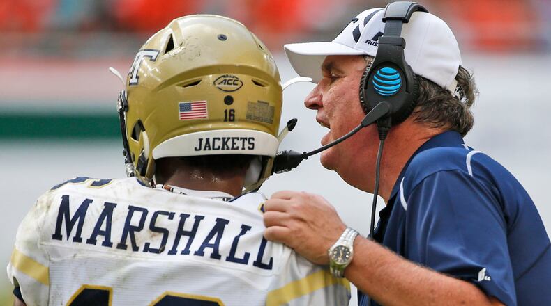 Georgia Tech head coach Paul Johnson talks with quarterback TaQuon Marshall (16) during the first half against Miami, Saturday, Oct. 14, 2017 in Miami Gardens, Fla.