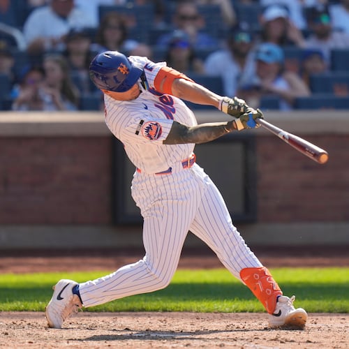 New York Mets' Tyrone Taylor hits a three-run home run during the ninth inning of a baseball game against the New York Yankees, Sunday, May 17, 2026, in New York. (AP Photo/Seth Wenig)