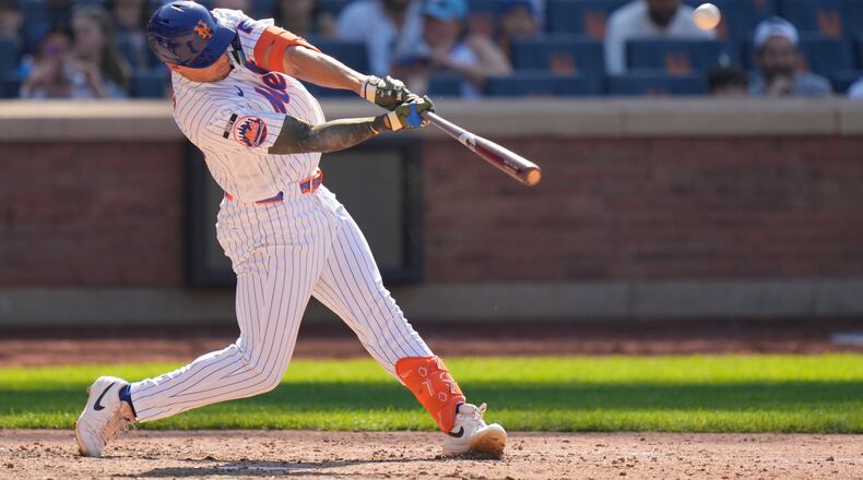 New York Mets' Tyrone Taylor hits a three-run home run during the ninth inning of a baseball game against the New York Yankees, Sunday, May 17, 2026, in New York. (AP Photo/Seth Wenig)
