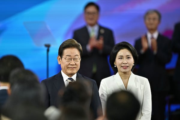 South Korea's newly-elected President Lee Jae-myung and his wife Kim Hye-kyung arrive for his inauguration ceremony at the National Assembly in Seoul Wednesday, June 4, 2025. (Anthony Wallace/Pool Photo via AP)