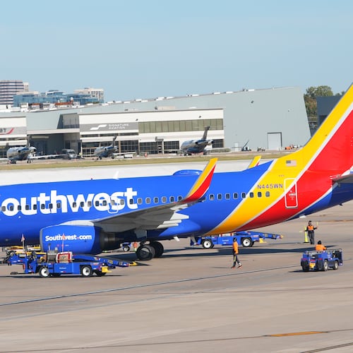 FILE - A Southwest Airlines jet pulls into a gate at Dallas Love Field Airport Tuesday, Nov. 11, 2025, in Dallas. (AP Photo/LM Otero, File)